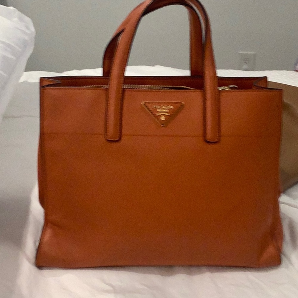 Prada tote. Worn. Light pen mark.